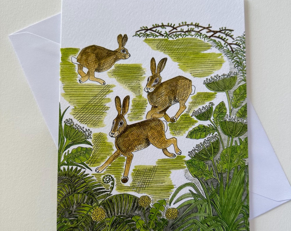 Frolicking Hares Greeting Card